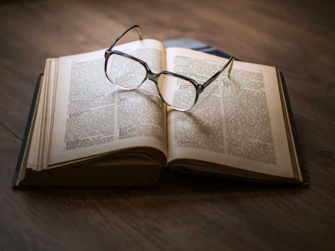 Trendy Glasses on a Book